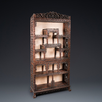 A Chinese reticulated hardwood display cabinet, 19th C.