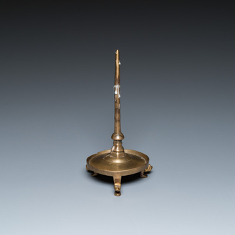 A Flemish or Dutch bronze candlestick, 14/15th C.