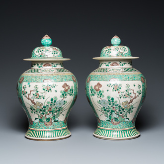 A pair of Chinese verte biscuit vases and covers, 19th C.