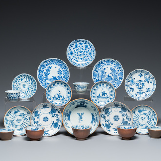 Eleven Chinese blue and white saucers, seven cups and a bowl, Kangxi/Qianlong