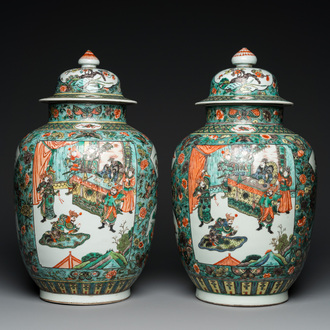 A pair of  Chinese famille verte vases and covers, 19th C.