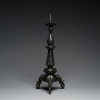 A large Chinese bronze reticulated candle holder, 17th C.