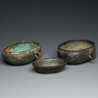 Three Chinese elliptical bronze cups, Eastern Zhou and Han