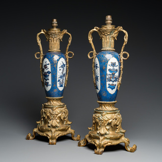 A pair of Chinese powder-blue vases with gilt bronze lamp mounts, Kangxi and 19th C.