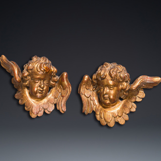 A pair of gilded wooden winged cherub heads, 18th C.