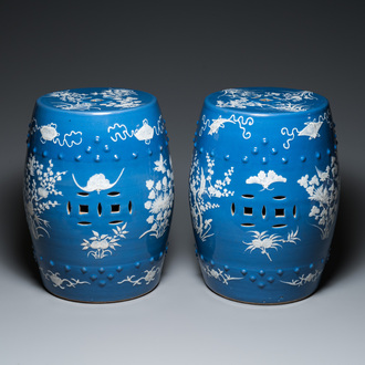 A pair of Chinese white slip-decorated blue-ground garden seats, 19th C.