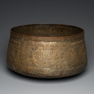 A large Islamic engraved bronze basin with calligraphic design, probably Egypt, 18/19th C.