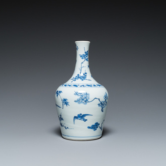 A Chinese blue and white bottle vase with birds among blossoms, Transitional period