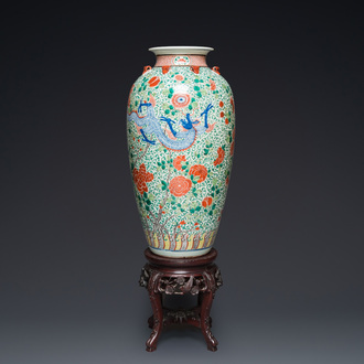 A very large Chinese famille verte 'dragon' vase on wooden stand, 19th C.