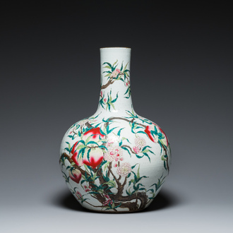 A Chinese famille rose 'nine peaches' bottle vase, Qianlong mark, 19th C.