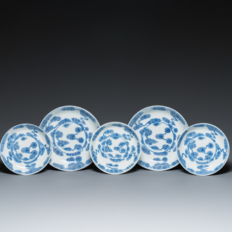 Two Chinese blue and white 'clouds' dishes and three plates, 19th C.