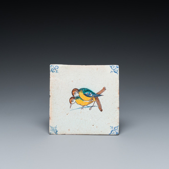 A rare polychrome Dutch Delft tile with mating birds, 17th C.