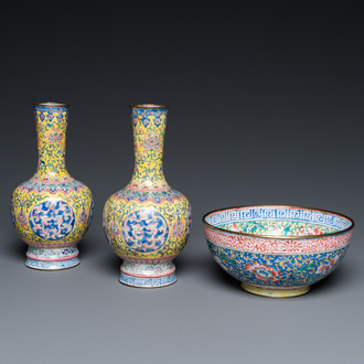 A pair of Chinese yellow-ground Canton enamel vases and a bowl, Yongzheng/Qianlong