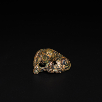 A Chinese gilt bronze ‘dog’ scroll weight, Ming