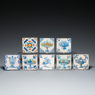 Eight Dutch Delft blue and white and polychrome tiles, 17th C.