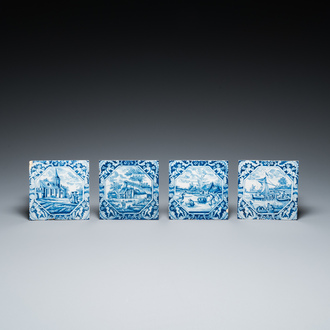 Four blue and white Dutch Delft tiles with fine landscapes and cherubs as corner motives, 18th C.