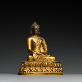 A Sino-Tibetan gilt bronze Buddha, 18th C.