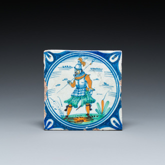 A polychrome Dutch maiolica medallion tile with a soldier, late 16th C.