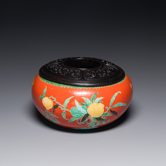 A Chinese relief-decorated alms bowl with wooden lid, Qianlong mark, 19/20th C.