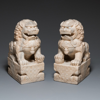 A pair of large Chinese white marble Buddhist lions, 19th C.