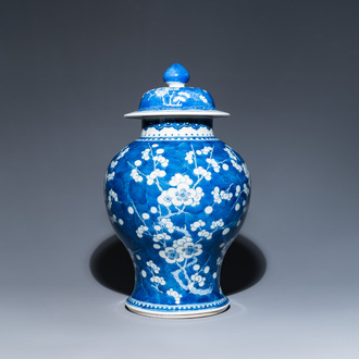 A Chinese blue and white 'prunus on cracked ice' vase and cover, Kangxi