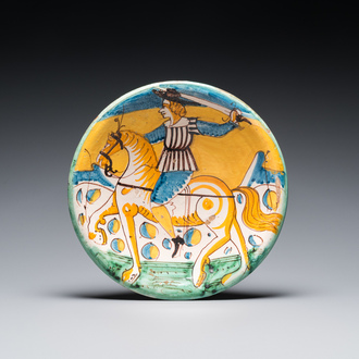 A polychrome Italian maiolica dish with a horserider, Montelupo, 17th C.