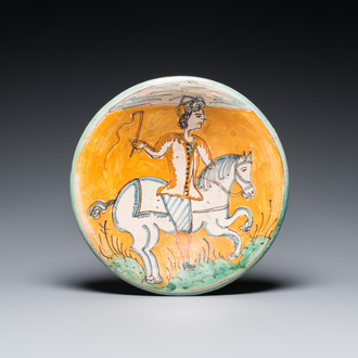 A polychrome Italian maiolica dish with a horserider, Montelupo, 17th C.