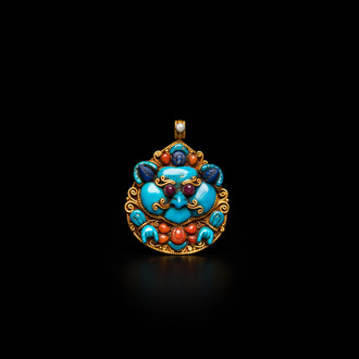 A fine gold pendant with coral, lapis lazuli and turquoise inlay, Nepal, 19th C.