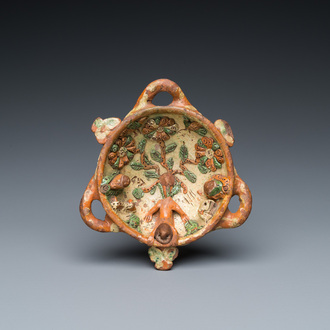 A slip-decorated three-handled earthenware bowl, probably Germany, 16/17th C.