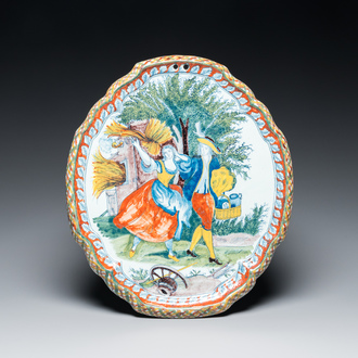 A polychrome Dutch Delft 'pastoral subject' plaque, 18/19th C.