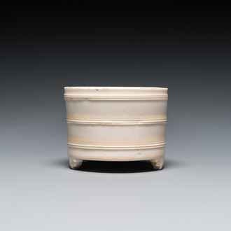 A Chinese Dehua blanc de Chine tripod censer, Kangxi