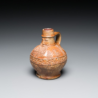 A small stoneware bellarmine jug with portrait medallions, Cologne, 16th C.