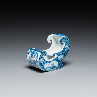 A Dutch Delft blue and white pipe stand in the shape of a sleigh, 18th C.
