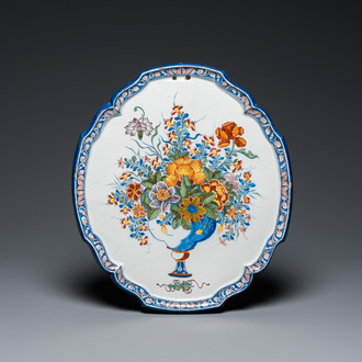 A fine polychrome Dutch Delft 'flower vase' plaque, 18th C.
