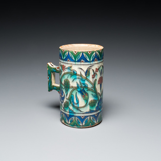 A polychrome Iznik-style mug, Kutahya, Turkey, 19th C.