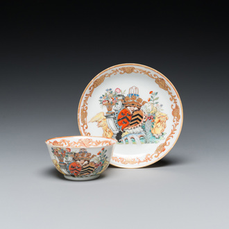 A Chinese Dutch market famille rose cup and saucer with the arms of van Isselmuden and van Haersolte, Qianlong