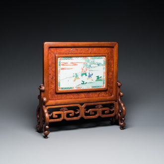 A Chinese famille verte plaque set in a partly huanghuali wooden table screen, Kangxi