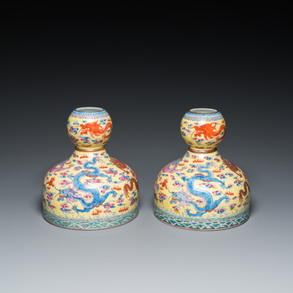 A pair of Chinese famille rose yellow-ground 'dragon' vases, Qianlong mark, 20th C.