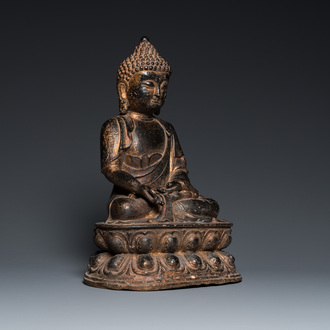 A large Chinese bronze Buddha with traces of gilding, Kangxi mark, Qing