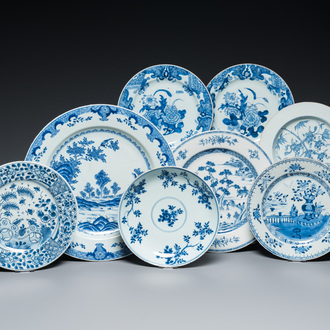 A Chinese blue and white dish and seven plates with flowers and landscapes, Kangxi/Qianlong