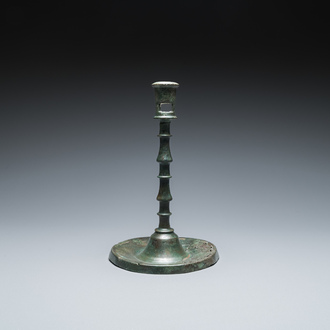 A Dutch or Flemish knotted bronze candlestick, 15th C.