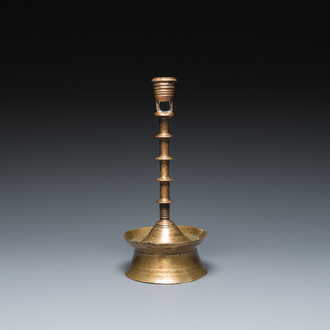 A Dutch or Flemish knotted bronze candlestick, 15/16th C.