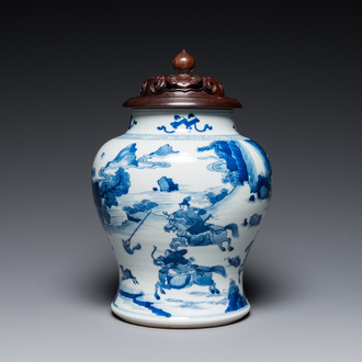 A Chinese blue and white 'Mongolian hunt' jar with wooden cover, Kangxi