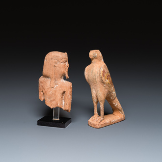 An Egyptian wooden Horus falcon and a fragment of a farao sculpture, Late Period