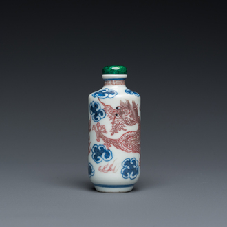 A Chinese blue, white and copper-red 'dragon' snuff bottle, Yongzheng mark, 19th C.