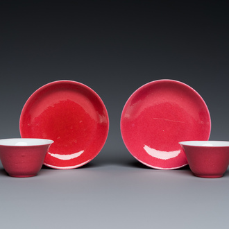 A pair of Chinese monochrome puce-glazed cups and saucers, 19/20th C.