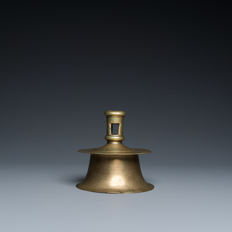 A Flemish brass capstan candlestick, 16th C.