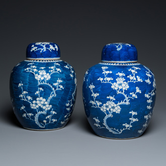 A pair of Chinese blue and white jars and covers, 19th C.