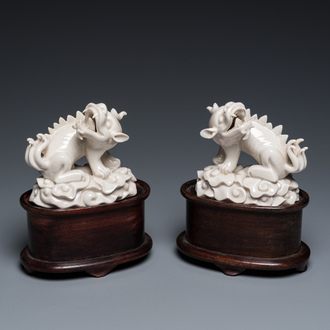 A pair of Chinese Dehua blanc de Chine models of xiezhi, probably Kangxi