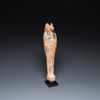 An Egyptian stucco painted wooden mummiform figure of Anubis, New Kingdom